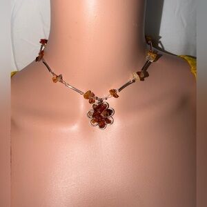 Elegant Floral Necklace with Amber Tones